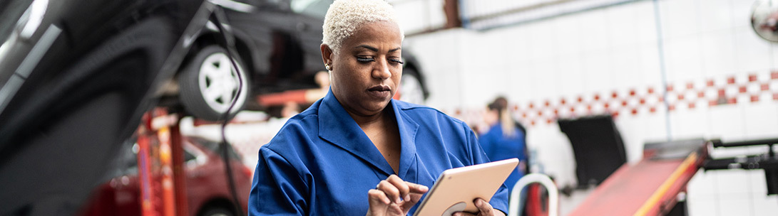 Worker checking notes